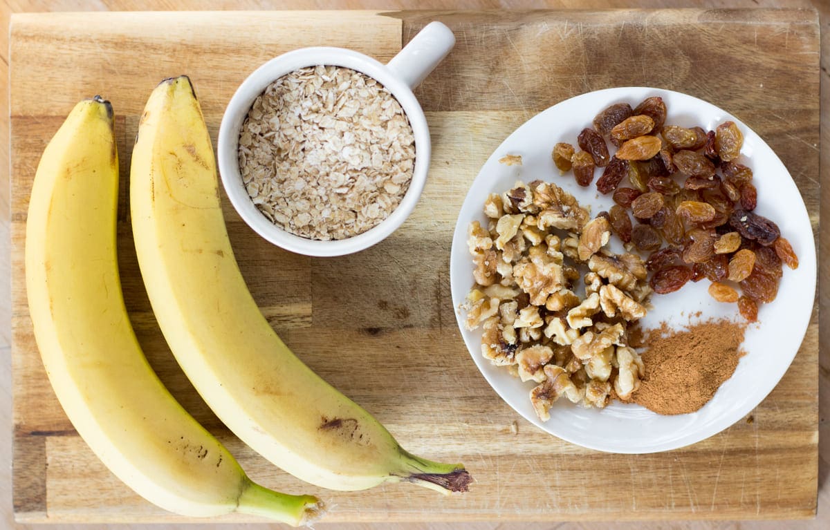 The banana oatmeal cookie ingredients are laid on a table | Hurry The Food Up