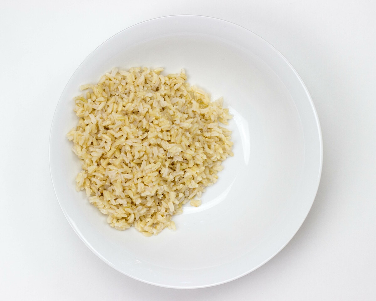 Basmati rice is plated on a white bowl and placed on a table | Hurry The Food Up