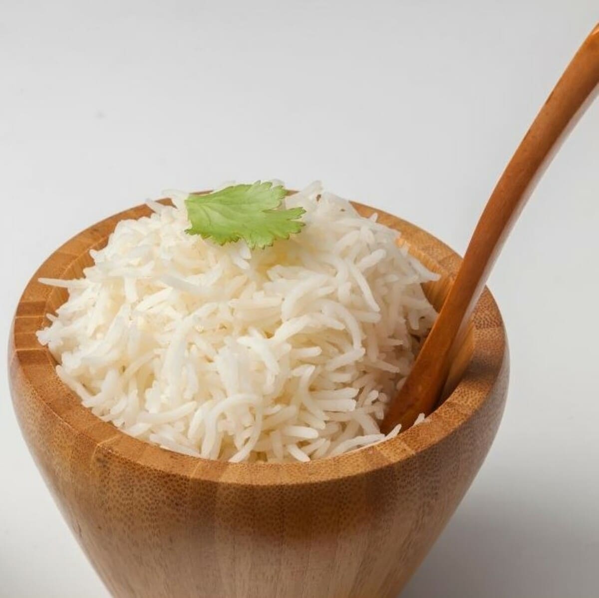 Basmati rice is being cooked in a steel pan | Hurry The Food Up