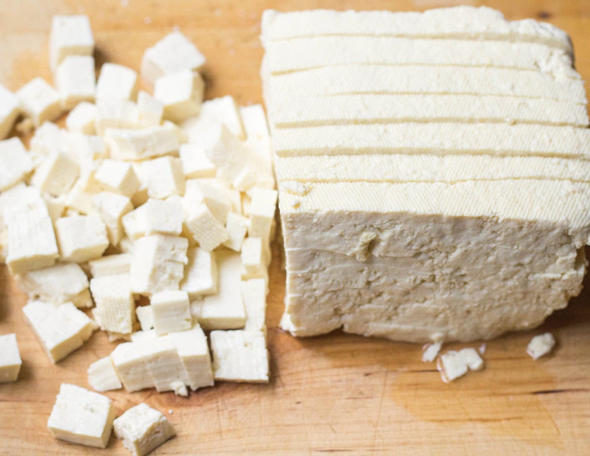 Firm tofu cut into cubes on the left and thick pieces on the right | Hurry The Food Up