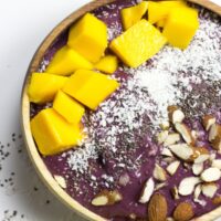 An acai bowl topped with coconut, chia, almonds, mango | Hurry The Food Up - 8