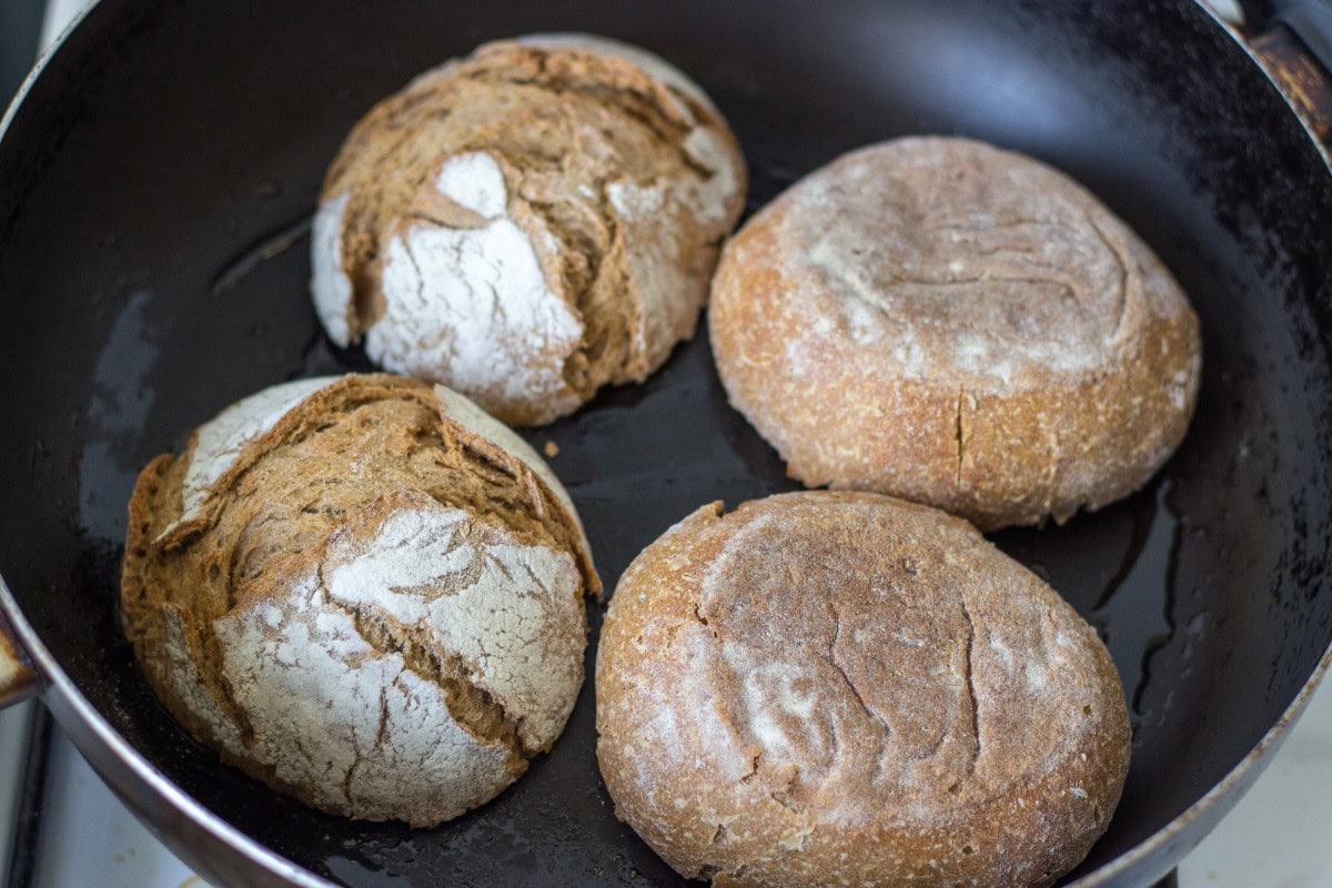 Two bread rolls face down in a frying pan toasting | Hurry The Food Up