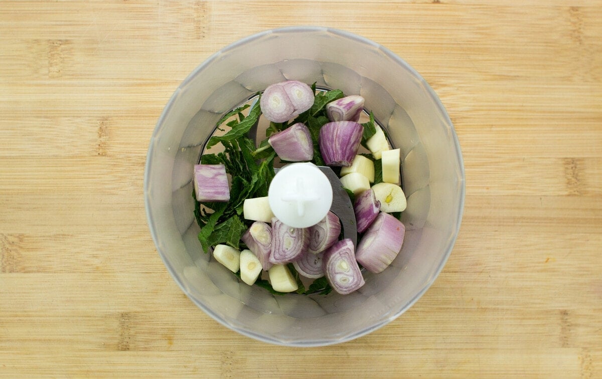 Ingredients for Pea and Mint Soup in a blender, ready to be pureed, shot from above | Hurry The Food Up