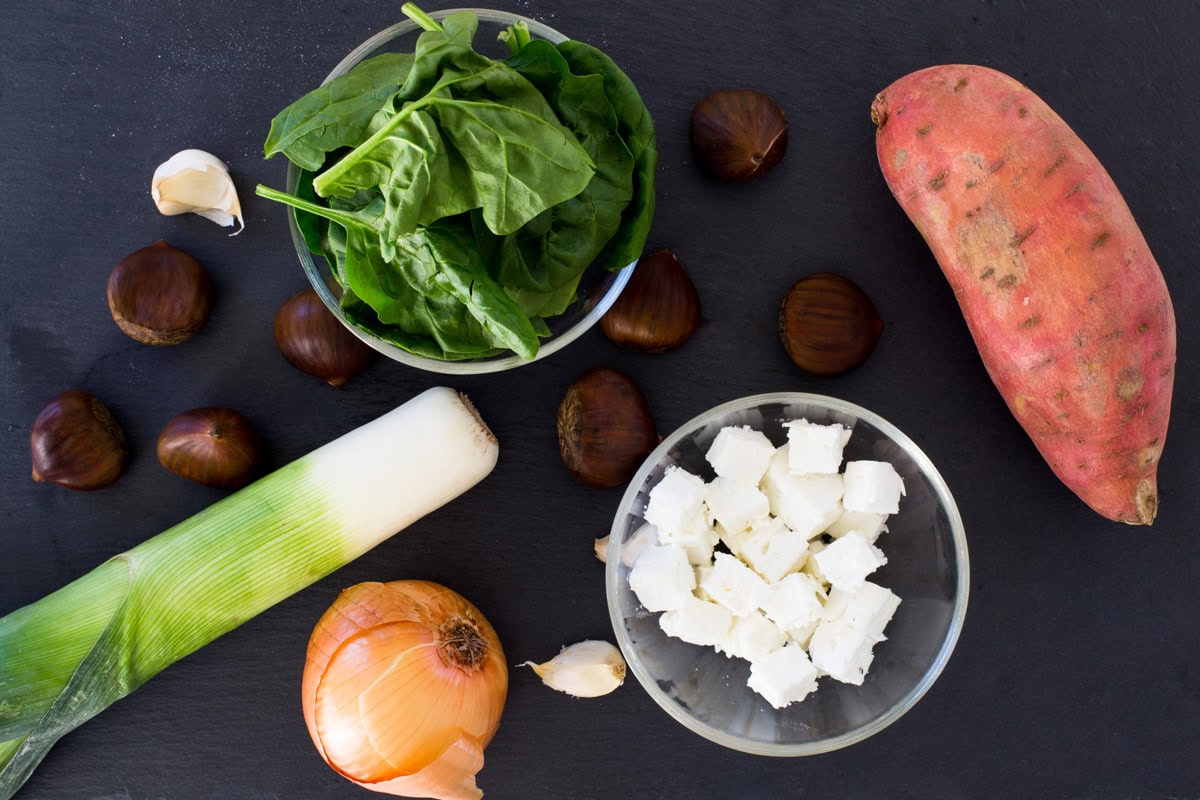 Vegetable Wellington ingredients like chestnuts, leek, onion, sweet potato, garlic, spinach | Hurry The Food Up