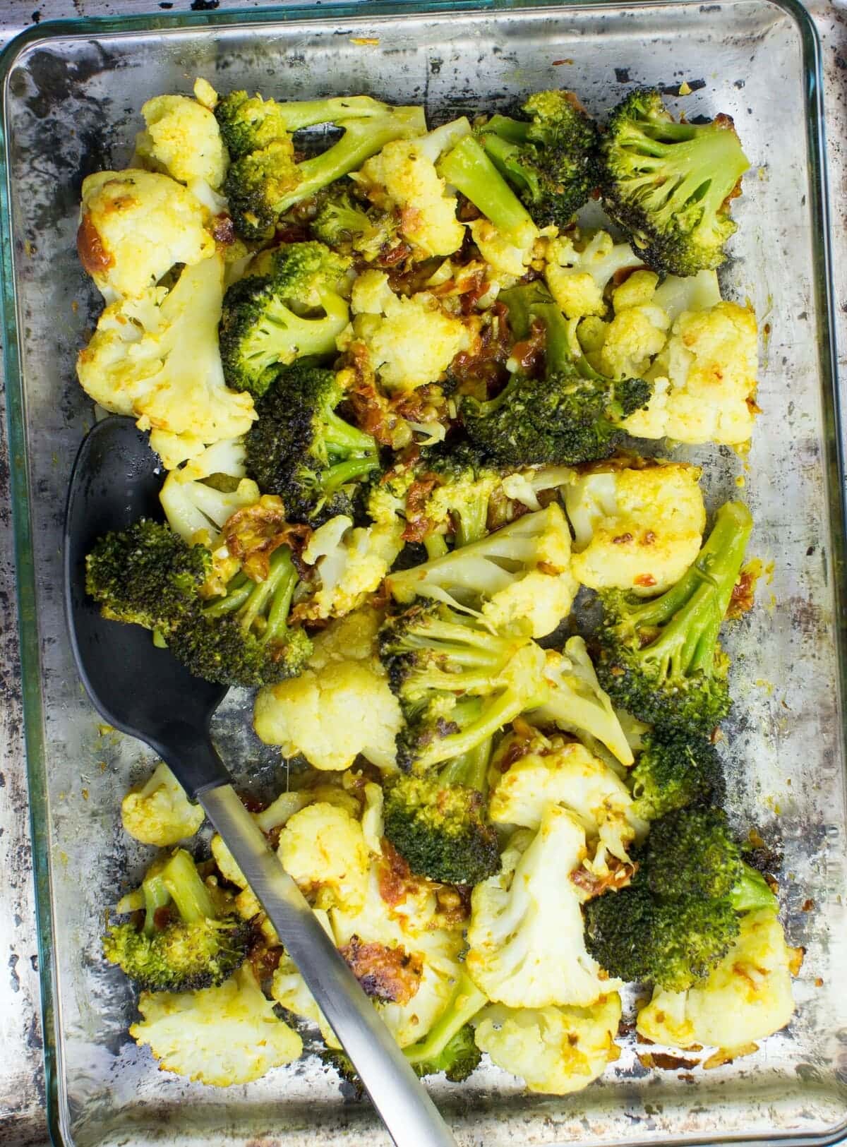 Roasted Broccoli and Cauliflower is spread unto a baking sheet in a single layer | Hurry The Food Up