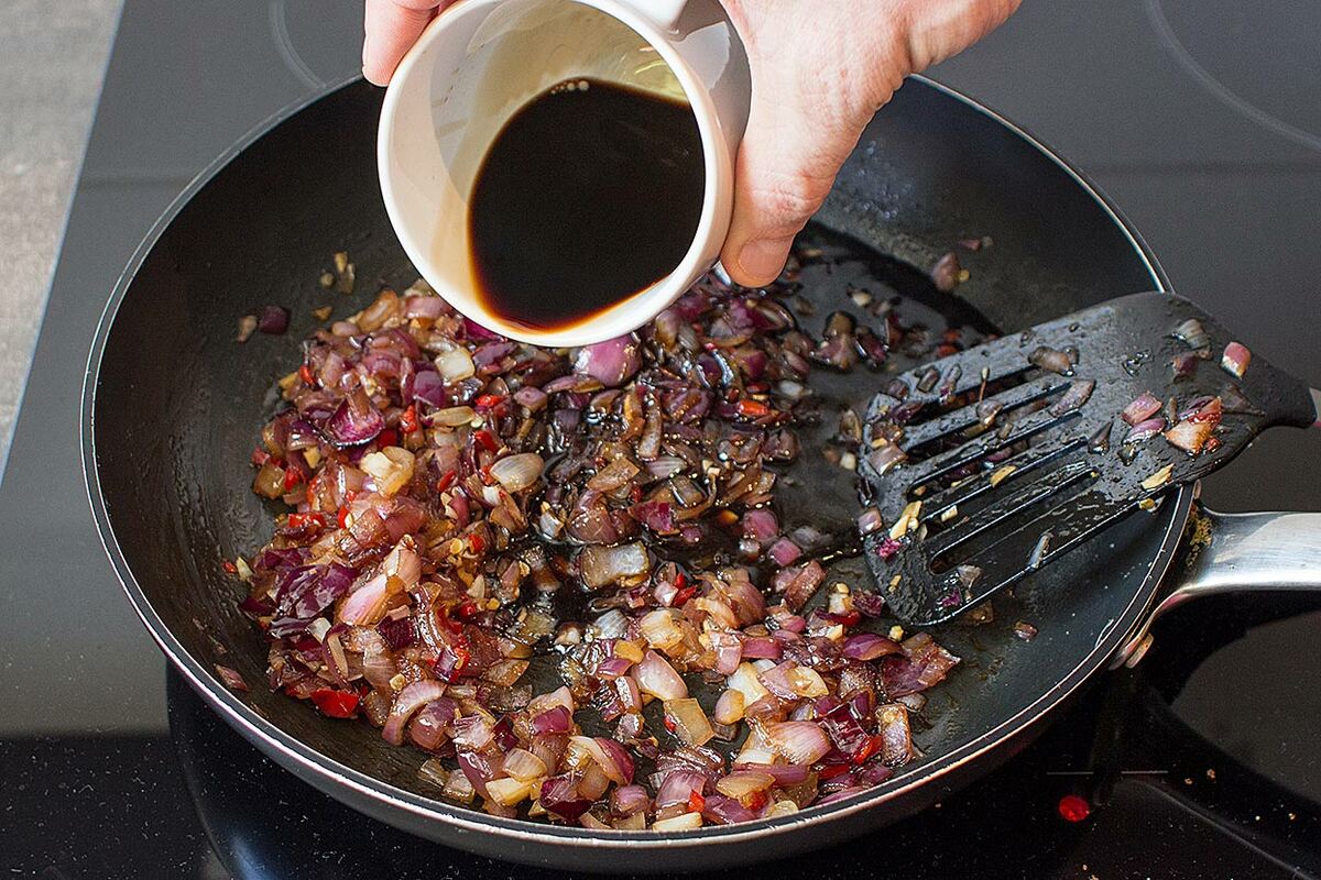 The ingredients with balsamic vinegar are cooking in the large pan | Hurry The Food Up