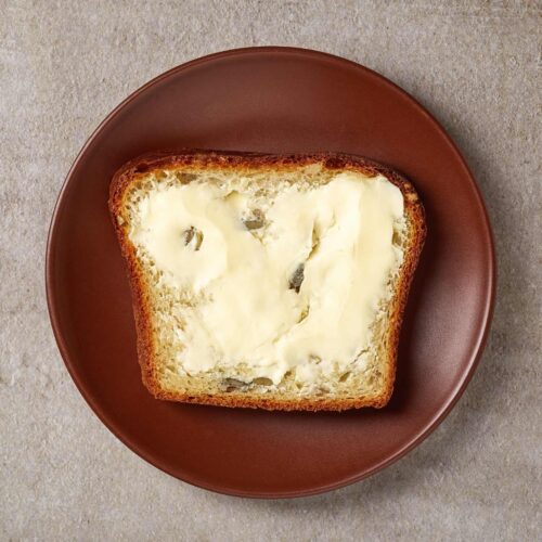1 Slice Wholegrain Bread with Butter on the brown plate | Hurry The Food Up