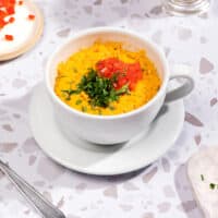 The microwave mug omelette is served on a mug that is on a white background | Hurry The Food Up - 6