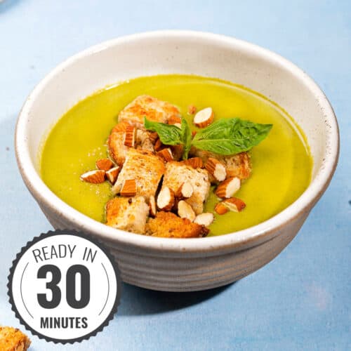 Zucchini basil soup in a white bowl with a time stamp in the bottom left hand corner. | Hurry The Food Up