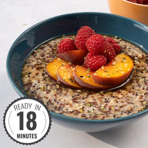 Fruity quinoa porridge is served in the bowl with pieces of peach and raspberries with a time badge in the bottom left corner | Hurry The Food Up