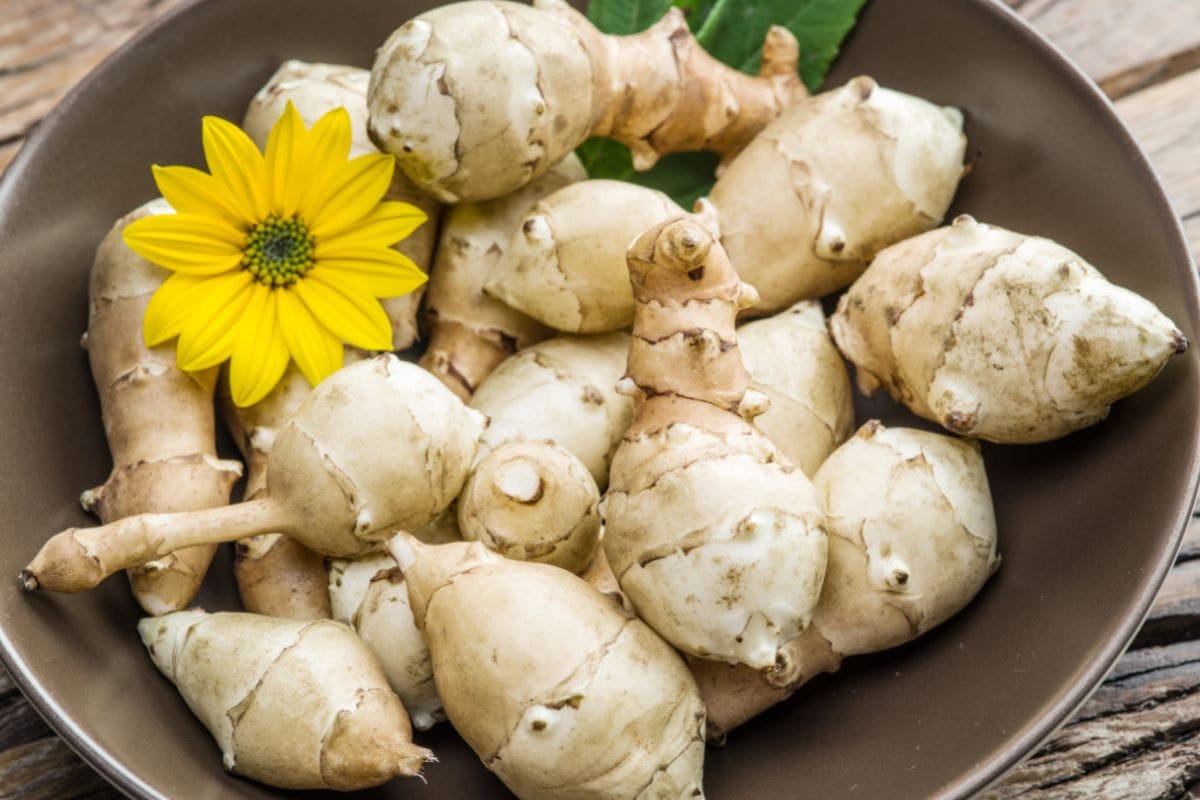 A bowl of jerusalem artichokes with a flower | Hurry The Food Up