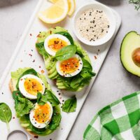 Healthy toast with sliced avocado, boiled eggs, spices and fresh spinach | Hurry The Food Up - 6