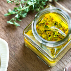 Lemon vinaigrette with thyme in a square jar - 34