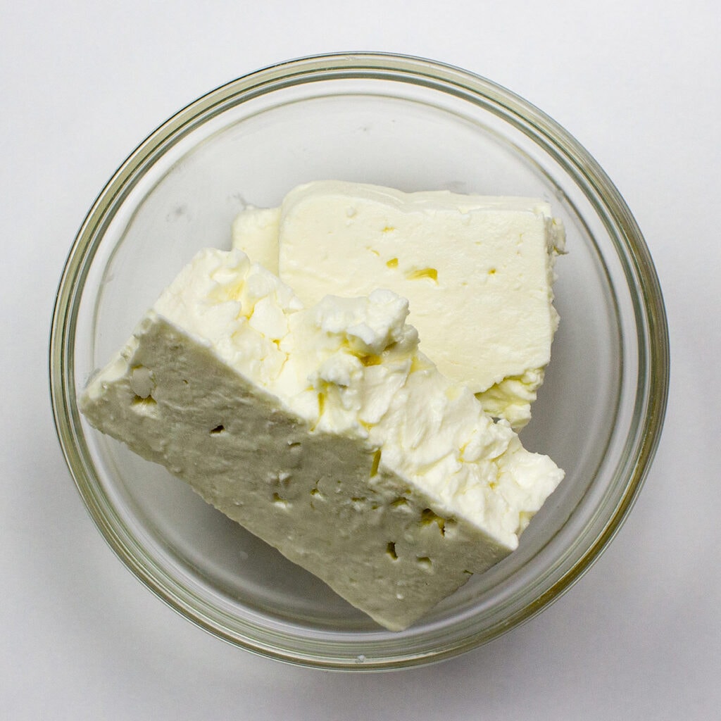 Feta cheese on white background