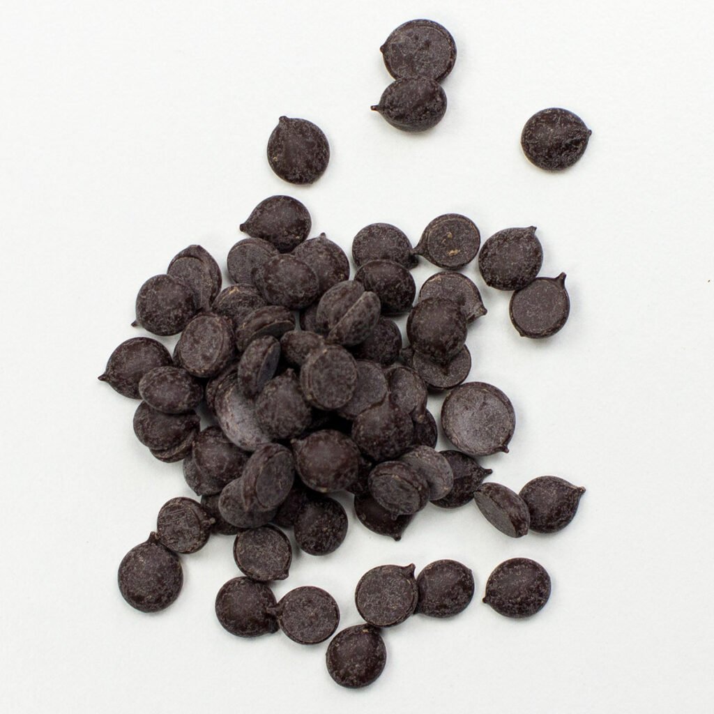 Cacao nibs on white surface