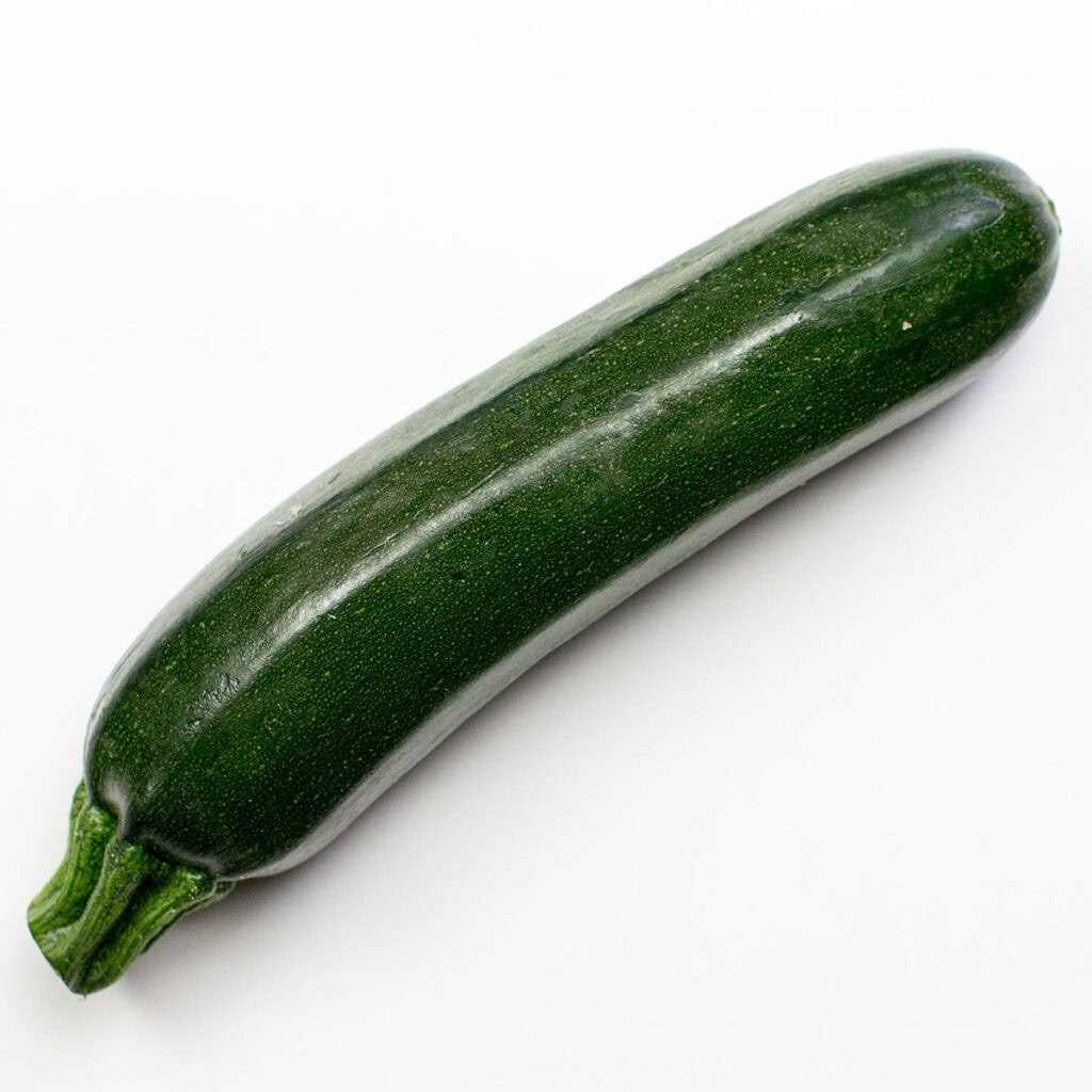 Zucchini on white background